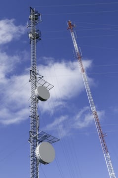 Communication towers stabilized with cables