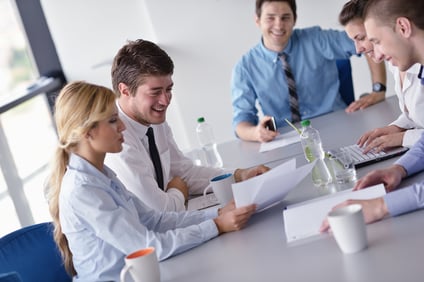 Group of happy young  business people in a meeting at office